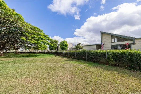 a backyard of a house with lots of green space