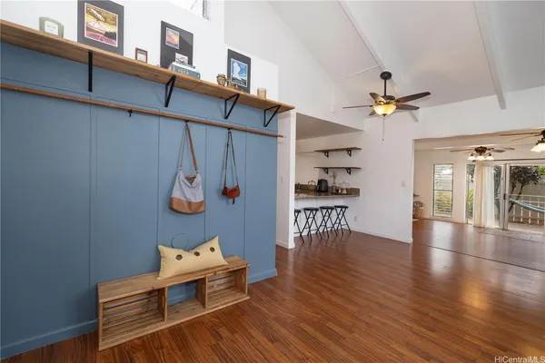 a view of a livingroom with furniture and hardwood floor