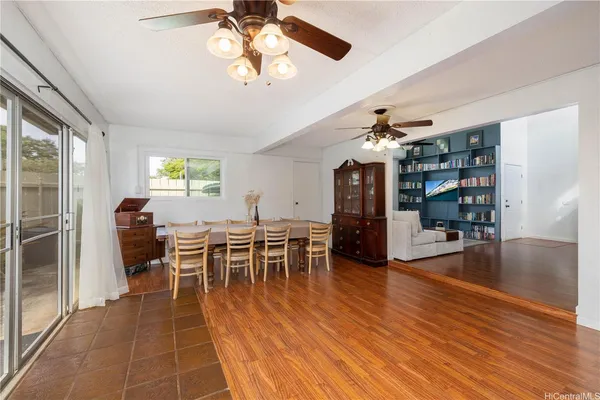 a view of a dining room with furniture and wooden floor