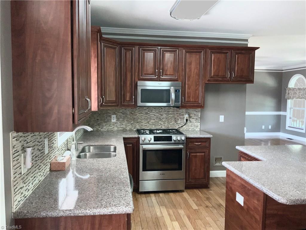 3369 Old Mountain Road Trinity, NC 27370 - Photo 9 of 17 Kitchen has Microwave ,dishwasher and slide in gas Range with granite counter tops