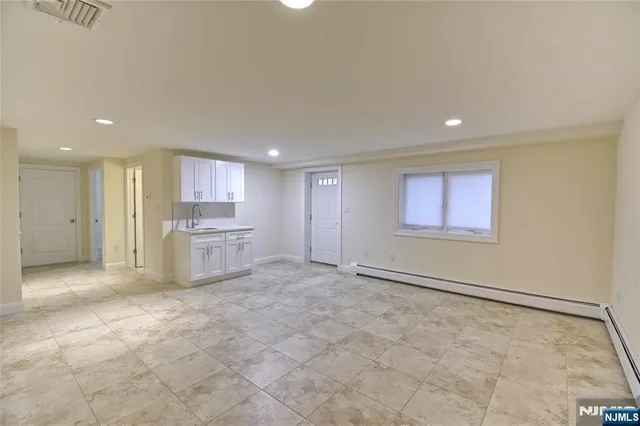 a view of a kitchen with a sink cabinets and a window