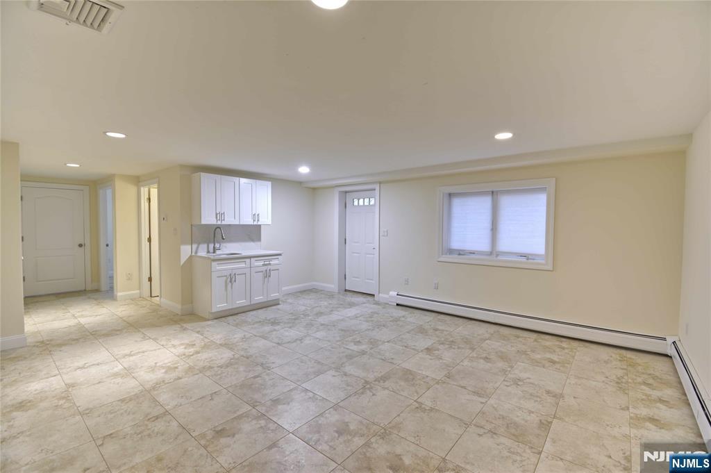 a view of a kitchen with a sink cabinets and a window