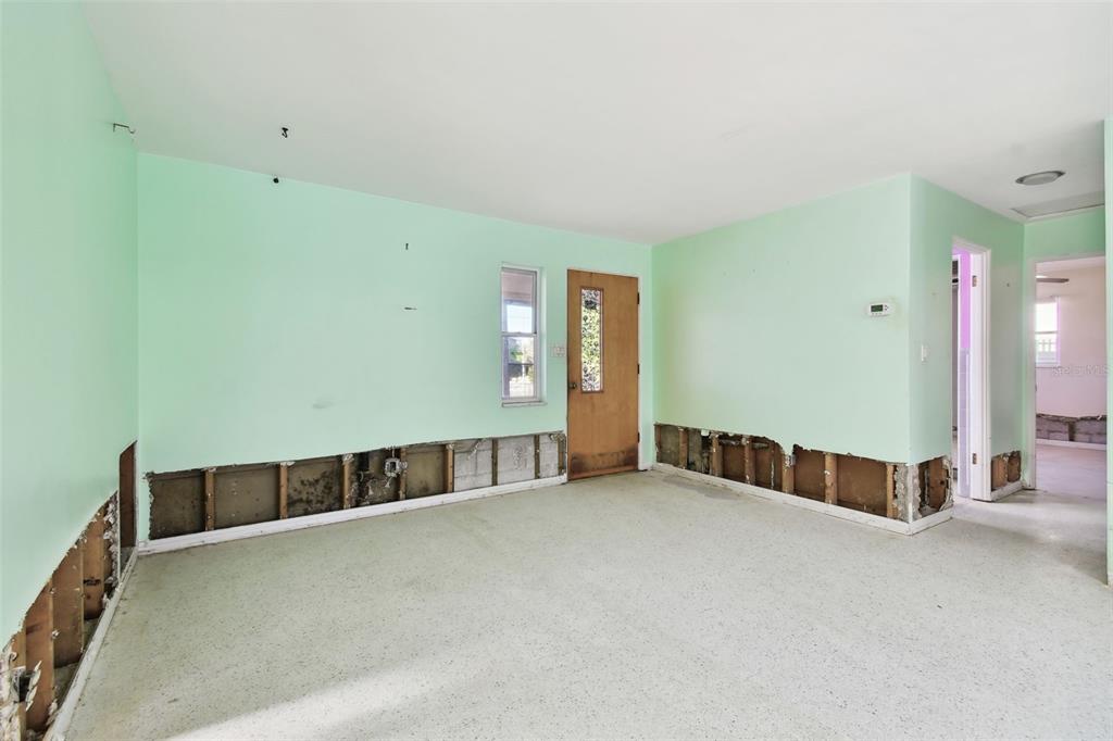 545 Lillian Drive Madeira Beach, FL 33708 - Photo 14 of 100 a view of an empty room with kitchen