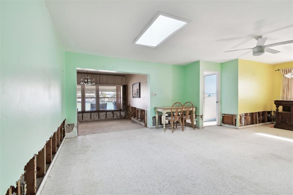 545 Lillian Drive Madeira Beach, FL 33708 - Photo 16 of 100 wooden floor and chairs in a room