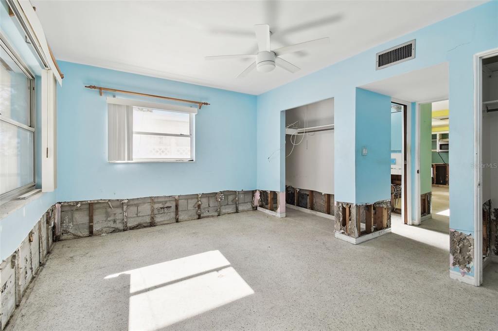 545 Lillian Drive Madeira Beach, FL 33708 - Photo 33 of 100 a living room with a couch and a chandelier