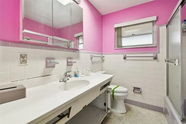 a view of a swimming pool and a lounge chair