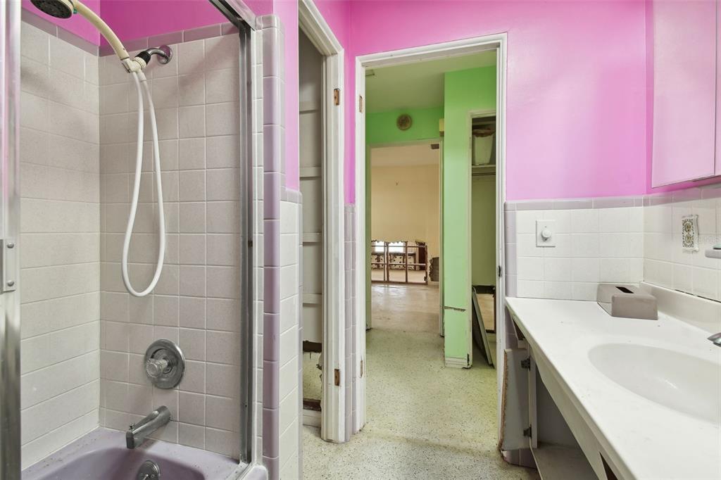 545 Lillian Drive Madeira Beach, FL 33708 - Photo 39 of 100 a bathroom with a sink shower and a mirror