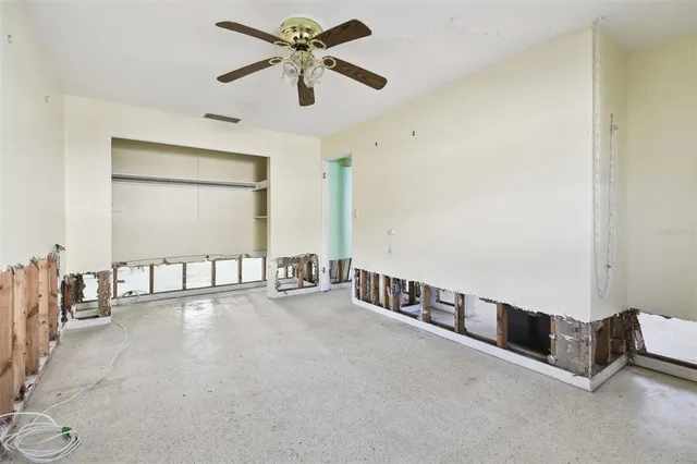 an aerial view of ocean and houses with outdoor space