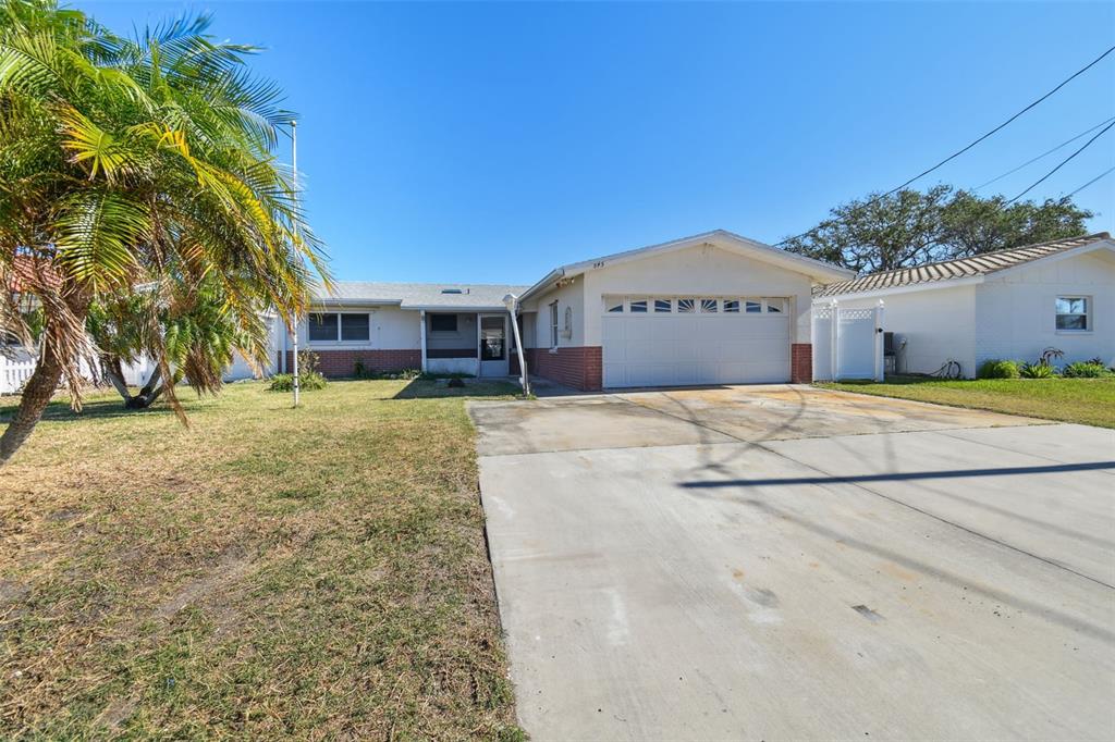 545 Lillian Drive Madeira Beach, FL 33708 - Photo 5 of 100 a view of a house with a yard