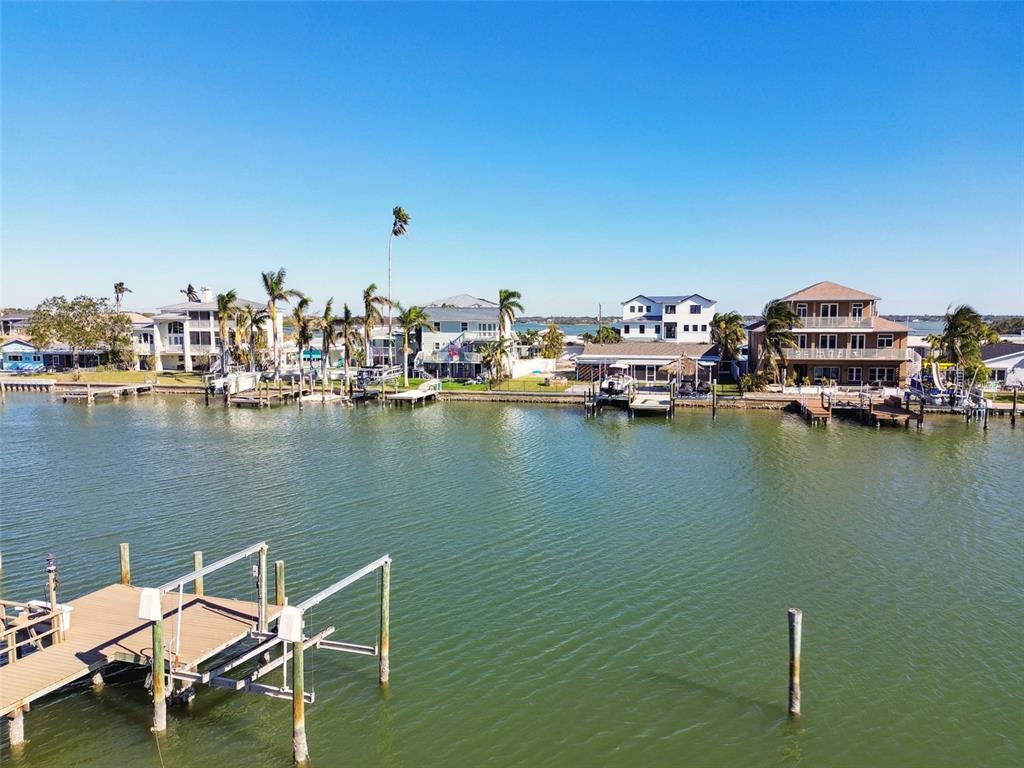 545 Lillian Drive Madeira Beach, FL 33708 - Photo 87 of 100 a view of a lake with outdoor seating