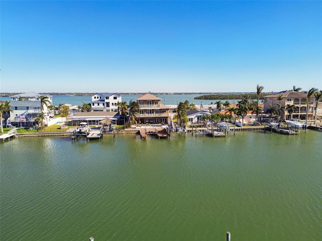 545 Lillian Drive Madeira Beach, FL 33708 - Photo 91 of 100 a view of a ocean with boats and trees in ocean