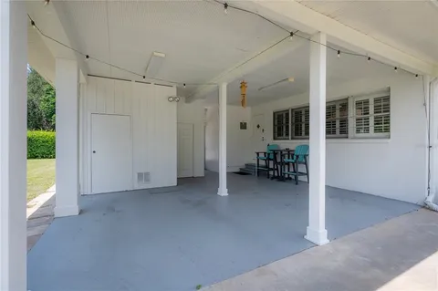 a view of a livingroom with furniture and a window