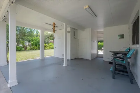 a view of a livingroom with furniture and a window