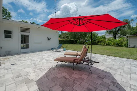 a view of a backyard with sitting area