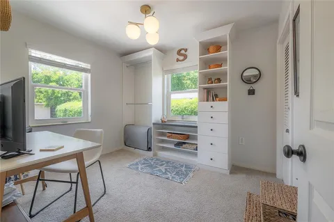 a workspace with furniture and window