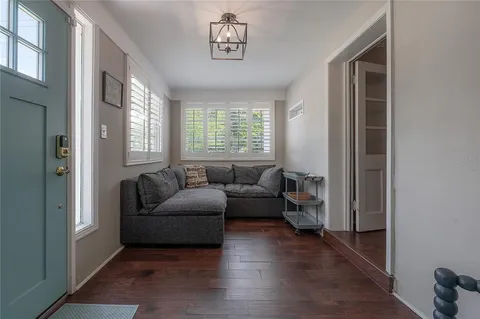 a living room with furniture and a window