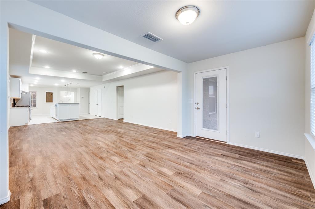 7793 Gulf Walk Road Frisco, TX 75036 - Photo 13 of 28 a view of an empty room and wooden floor