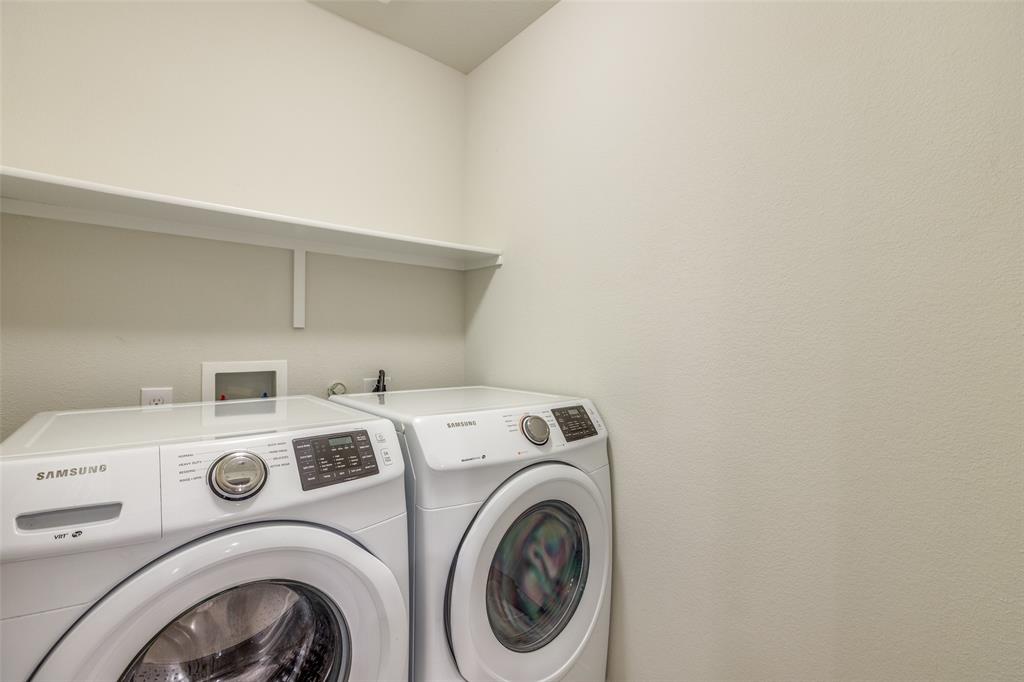 7793 Gulf Walk Road Frisco, TX 75036 - Photo 22 of 28 a utility room with dryer and washer