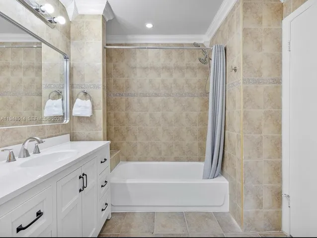a bathroom with a bathtub and a sink