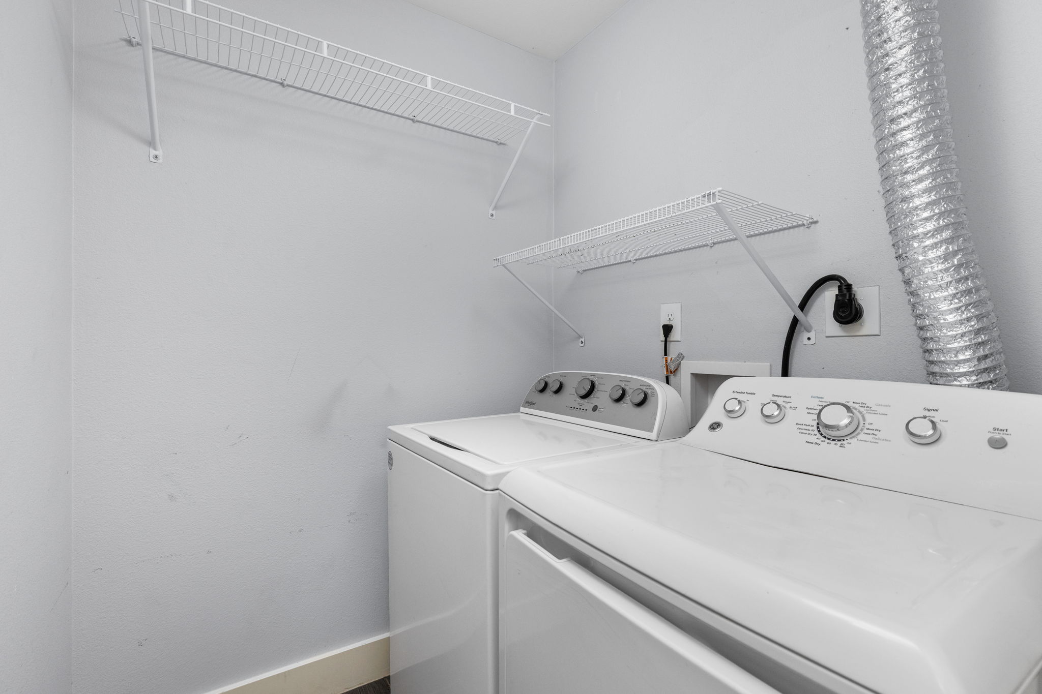 909 Reinli Street, Unit 232 Austin, TX 78751 - Photo 11 of 13 a utility room with dryer and washer