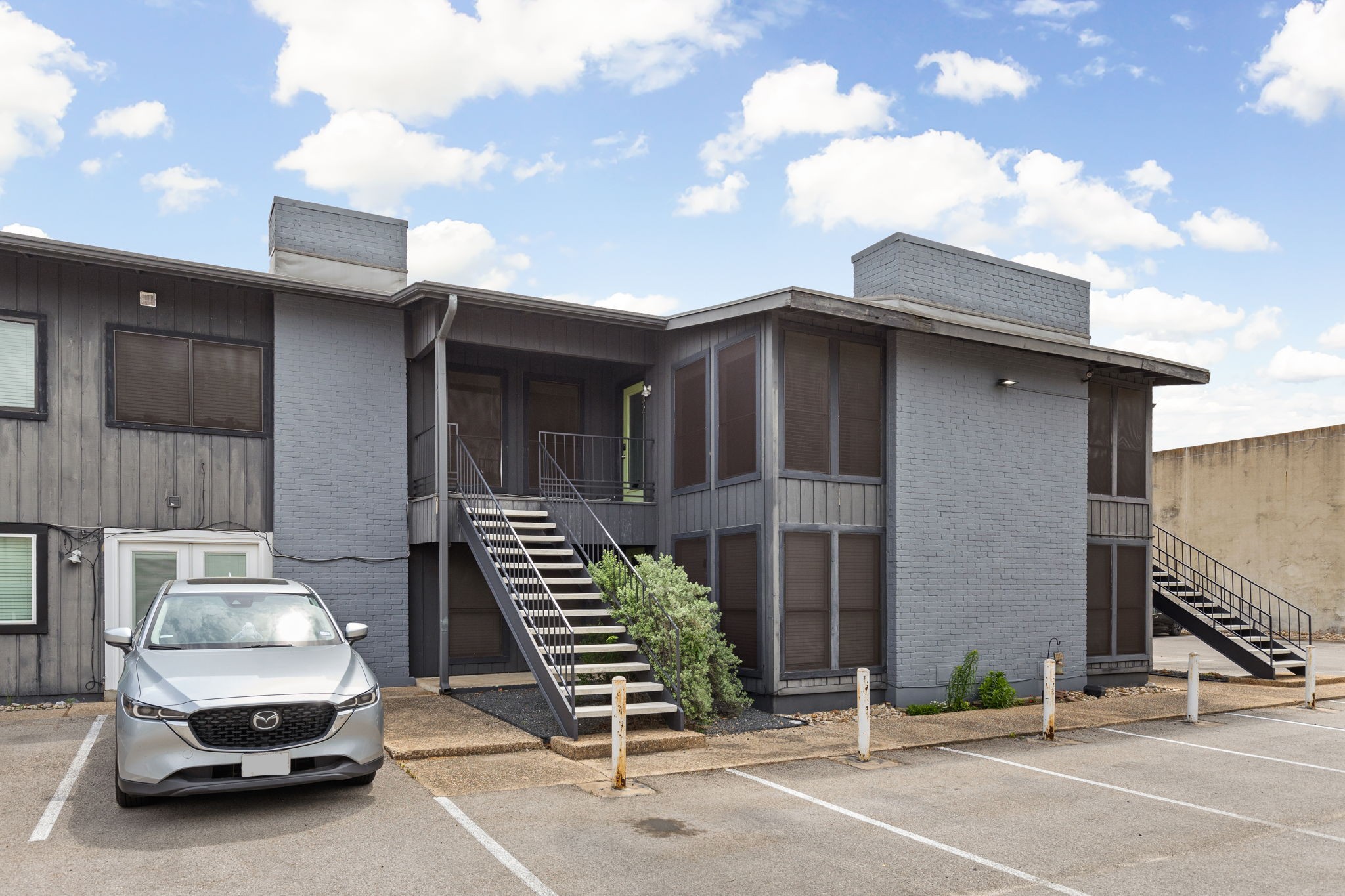 909 Reinli Street, Unit 232 Austin, TX 78751 - Photo 13 of 13 a car parked in front of a house
