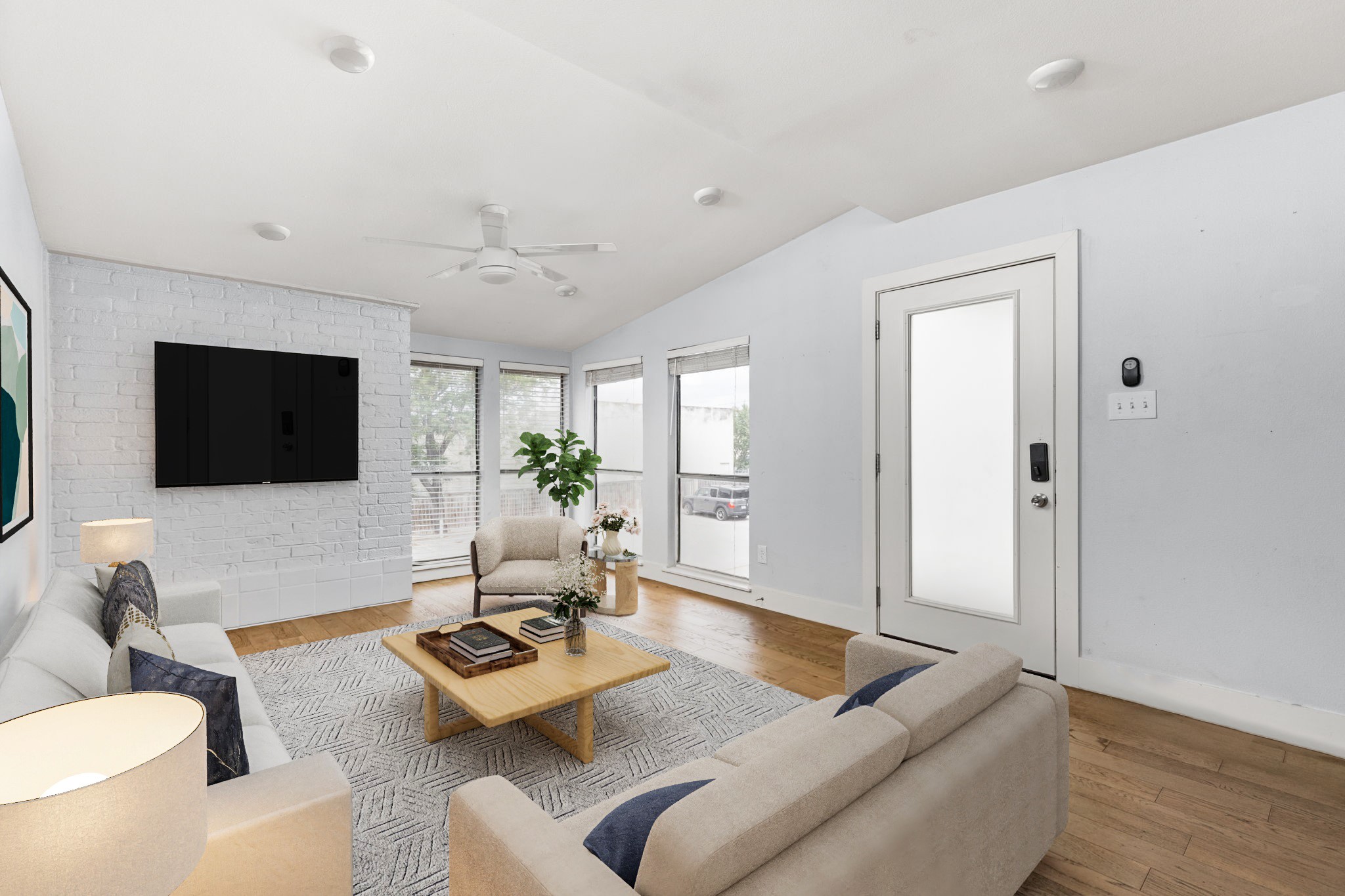 909 Reinli Street, Unit 232 Austin, TX 78751 - Photo 2 of 13 a living room with furniture and a flat screen tv