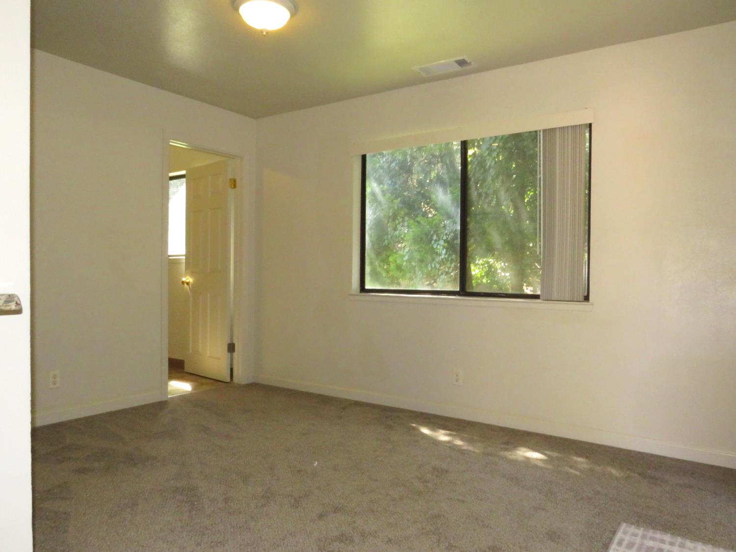 19245 Geisendorfer Road Applegate, CA 95703 - Photo 10 of 59 Dining room with a door to the laundry room. This room could be used as a home office or a 3rd bedroom.