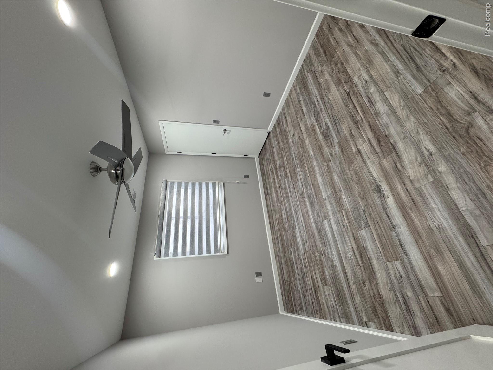 50493 Nesting Ridge Drive Macomb, MI 48044 - Photo 28 of 34 Unfurnished room featuring recessed lighting, light wood-type flooring, and ceiling fan