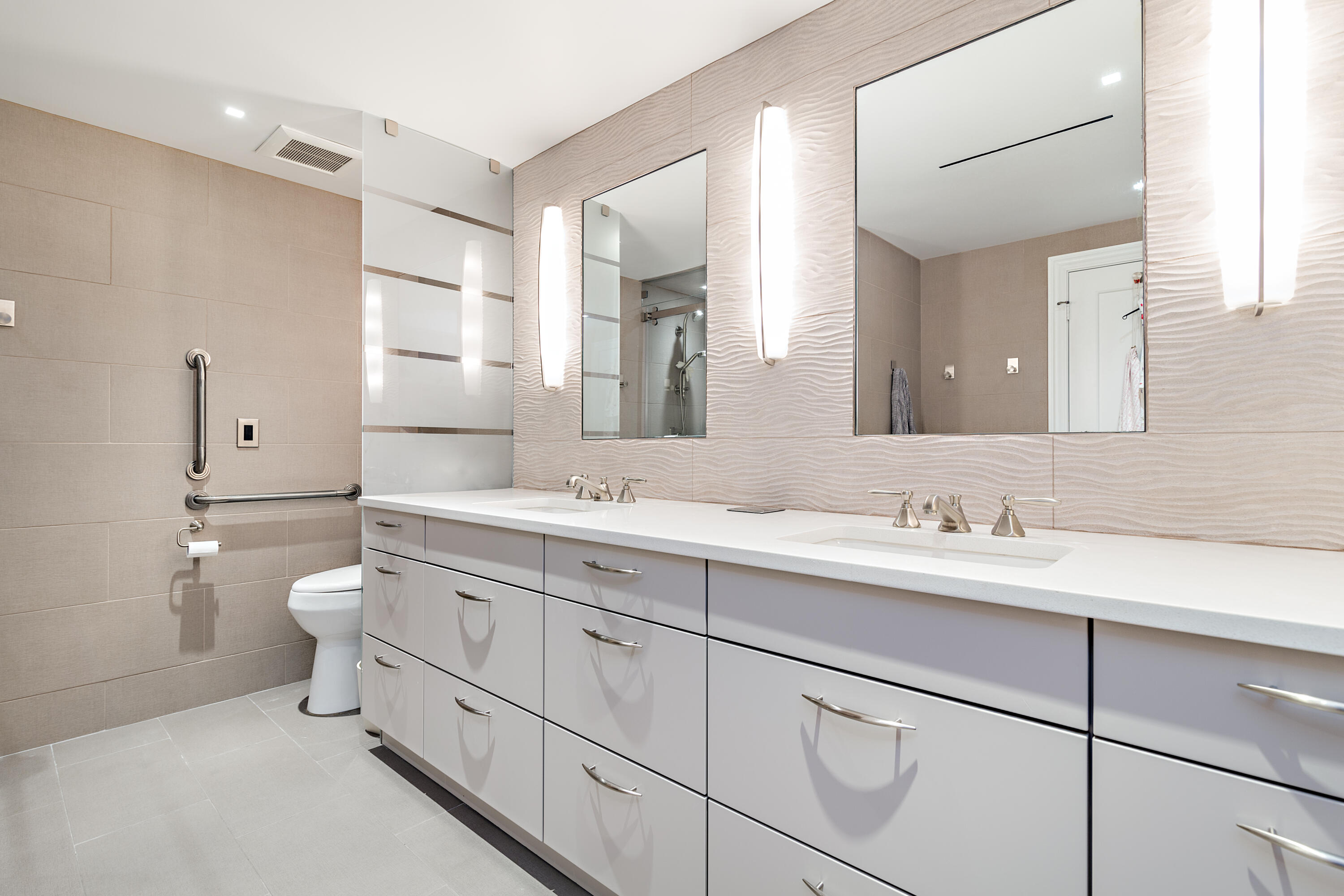 400 South Ocean Boulevard, Unit 419 Palm Beach, FL 33480 - Photo 11 of 24 a bathroom with a toilet a sink a mirror and a shower