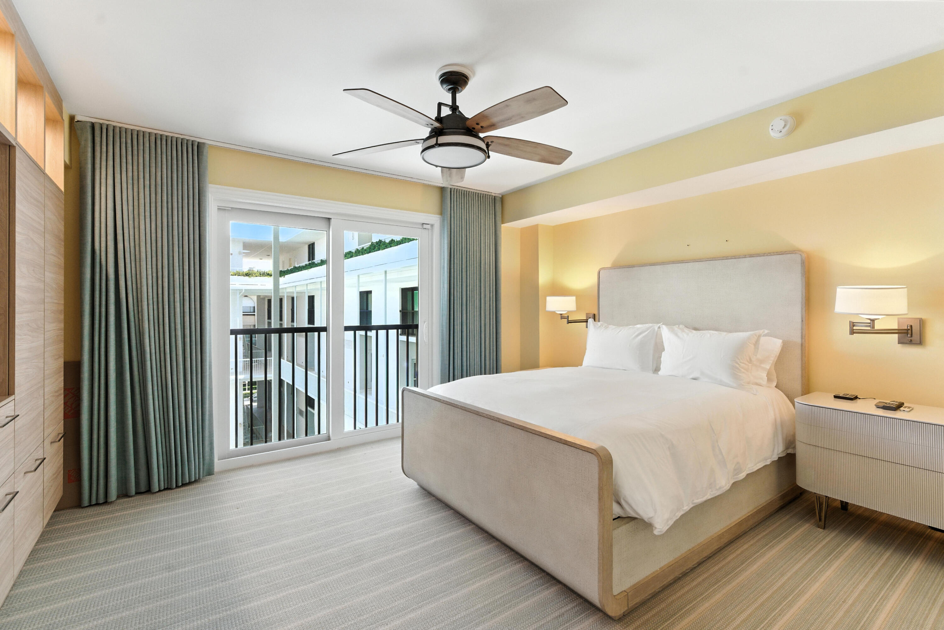 400 South Ocean Boulevard, Unit 419 Palm Beach, FL 33480 - Photo 12 of 24 a bedroom with a bed and a chandelier