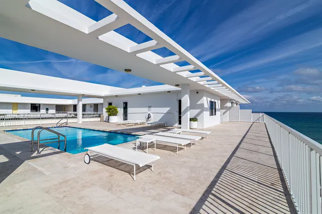 a view of kitchen and dining room with wooden floor
