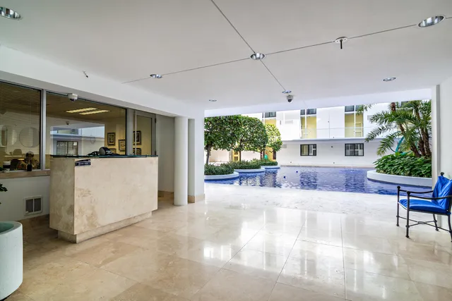 a view of a living room and kitchen