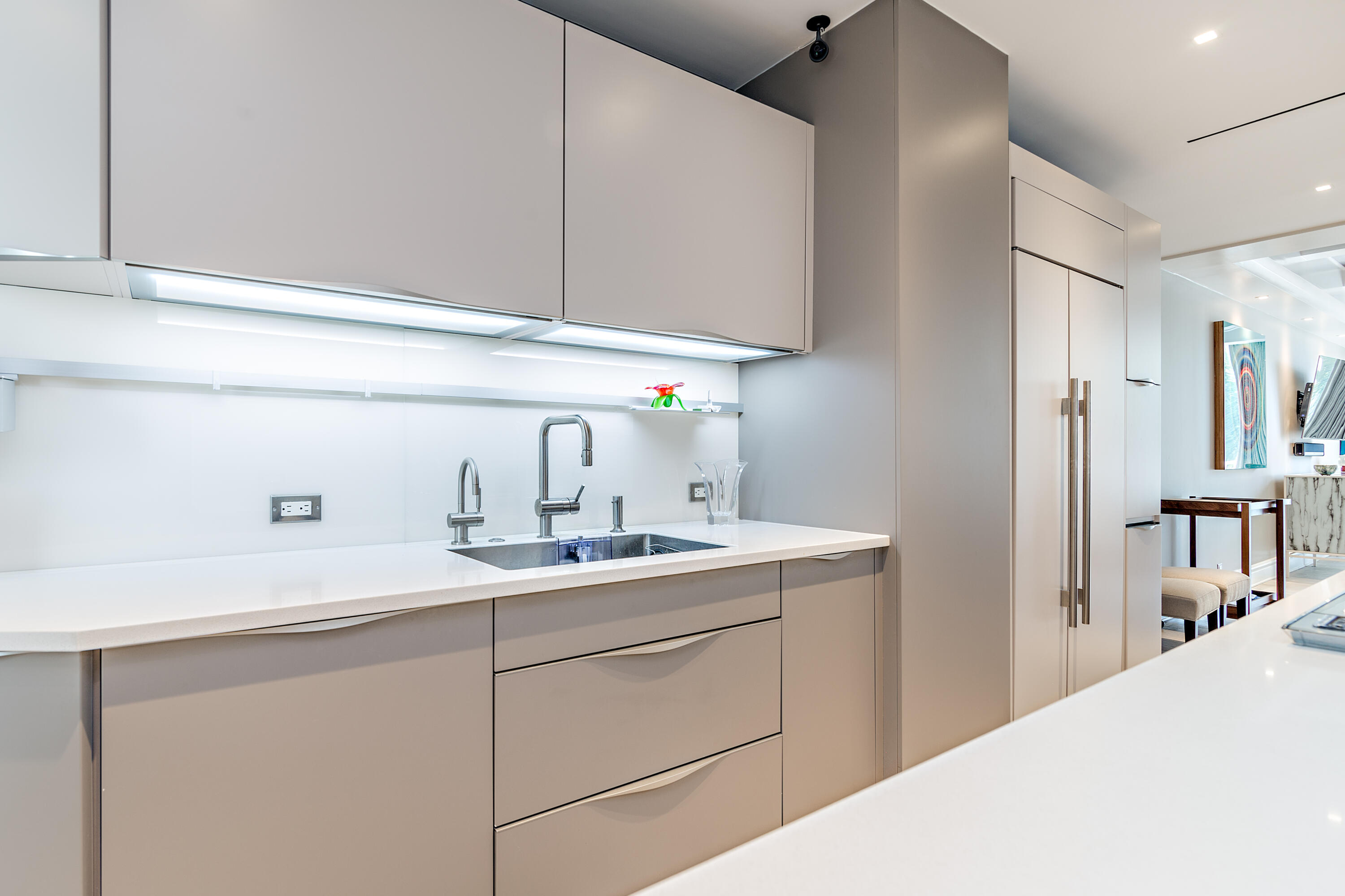 400 South Ocean Boulevard, Unit 419 Palm Beach, FL 33480 - Photo 7 of 24 a kitchen with a sink and cabinets