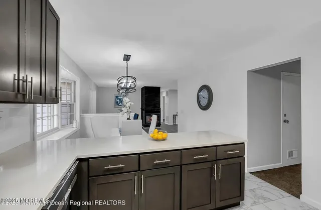 a room with a refrigerator and a sink