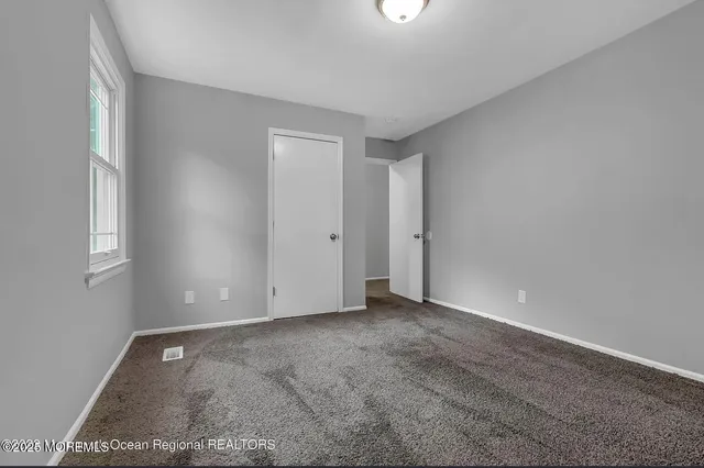 a view of an empty room with window