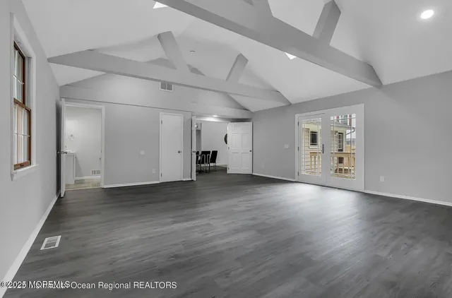 a view of a livingroom with wooden floor