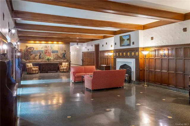 a lobby with furniture and a potted plant