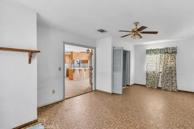 a view of empty room with windows