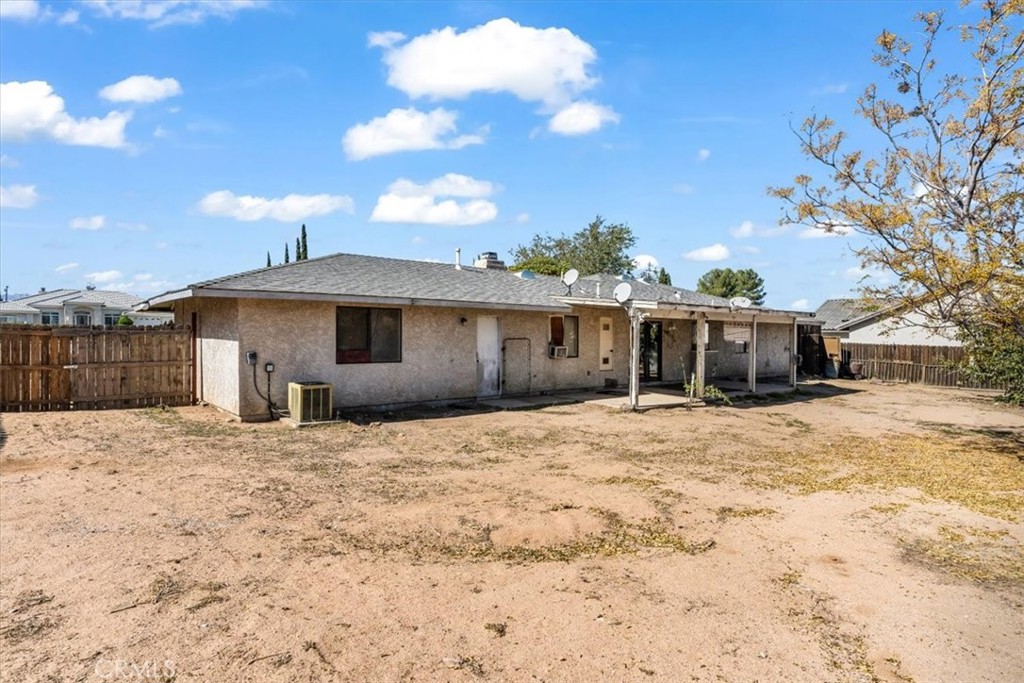 7633 I Avenue Hesperia, CA 92345 - Photo 21 of 22 a front view of a house with a yard