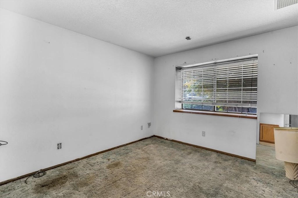 7633 I Avenue Hesperia, CA 92345 - Photo 9 of 22 a view of an empty room with a window