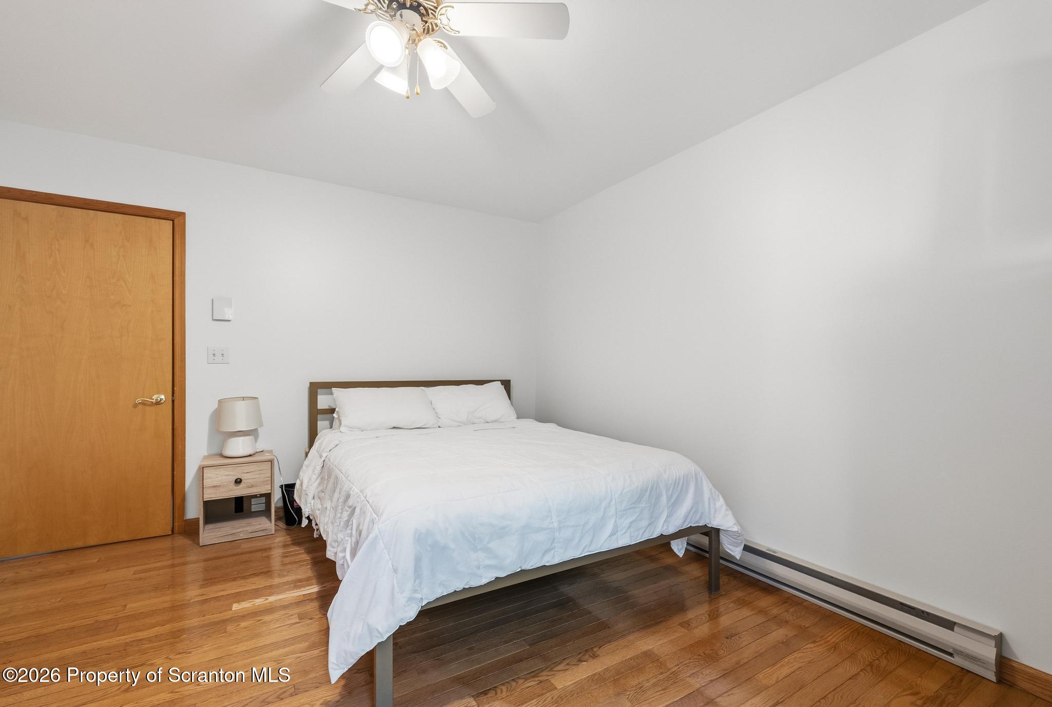 58 Bender Road Gouldsboro, PA 18424 - Photo 25 of 55 a bedroom with a bed and a chandelier