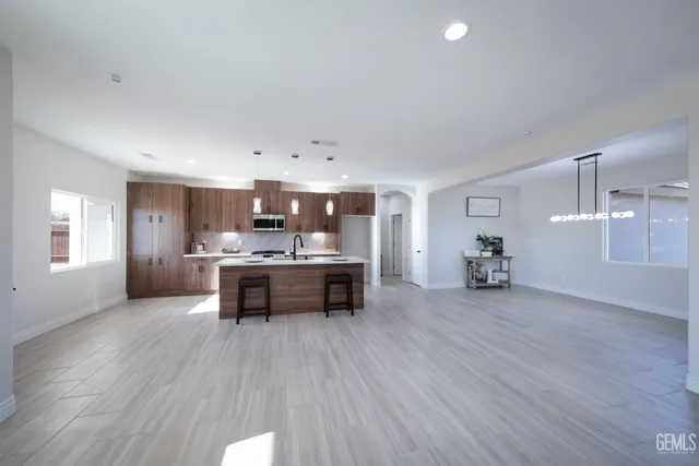 a dining room with furniture and wooden floor