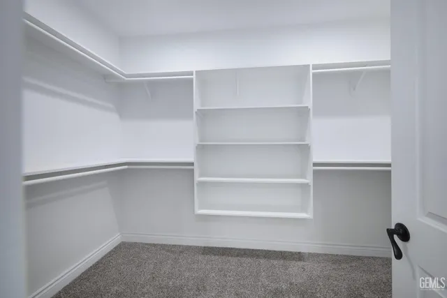 a view of an empty walk in closet