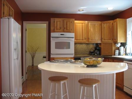 2523 Ridge Road Cresco, PA 18326 - Photo 4 of 18 KITCHEN W/ CORIAN ISLAND, BREAKFAST BAR