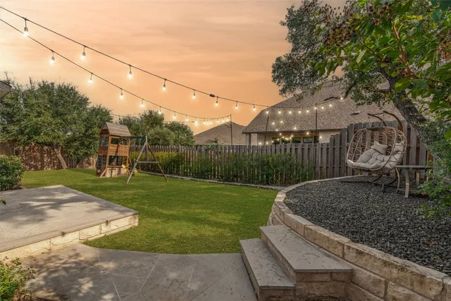 a view of a park that has a large tree