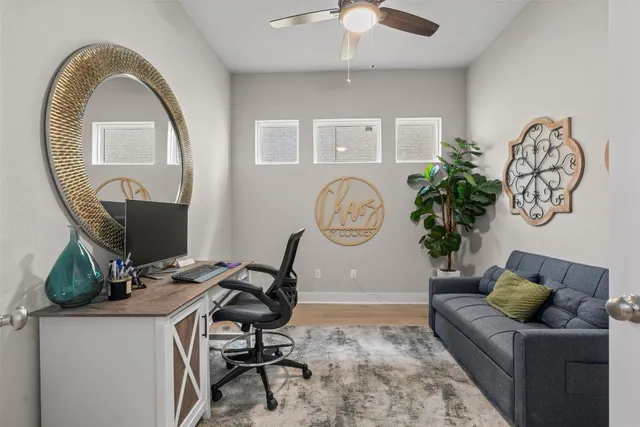 a living room with furniture and a mirror