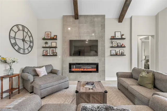 a living room with furniture and a fireplace