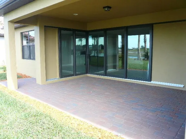 a view of a lake with houses in the background