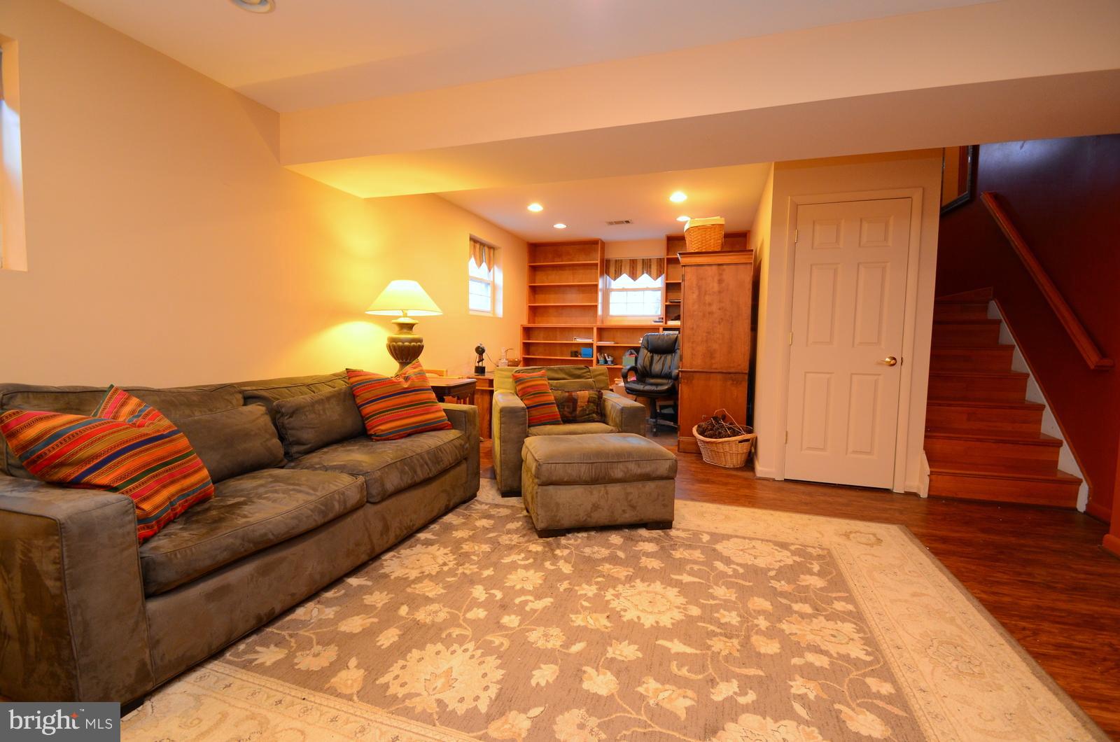 3718 Nile Road Davidsonville, MD 21035 - Photo 14 of 26 Lower Level Family Room with Built in Bookshelves