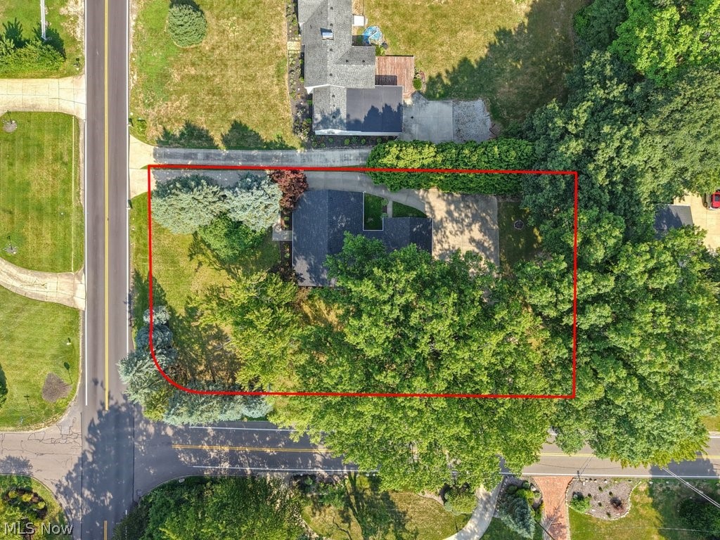 2468 Ridgewood Road Akron, OH 44313 - Photo 47 of 50 Corner lot property with mature trees and established landscaping, bordered by paved roads